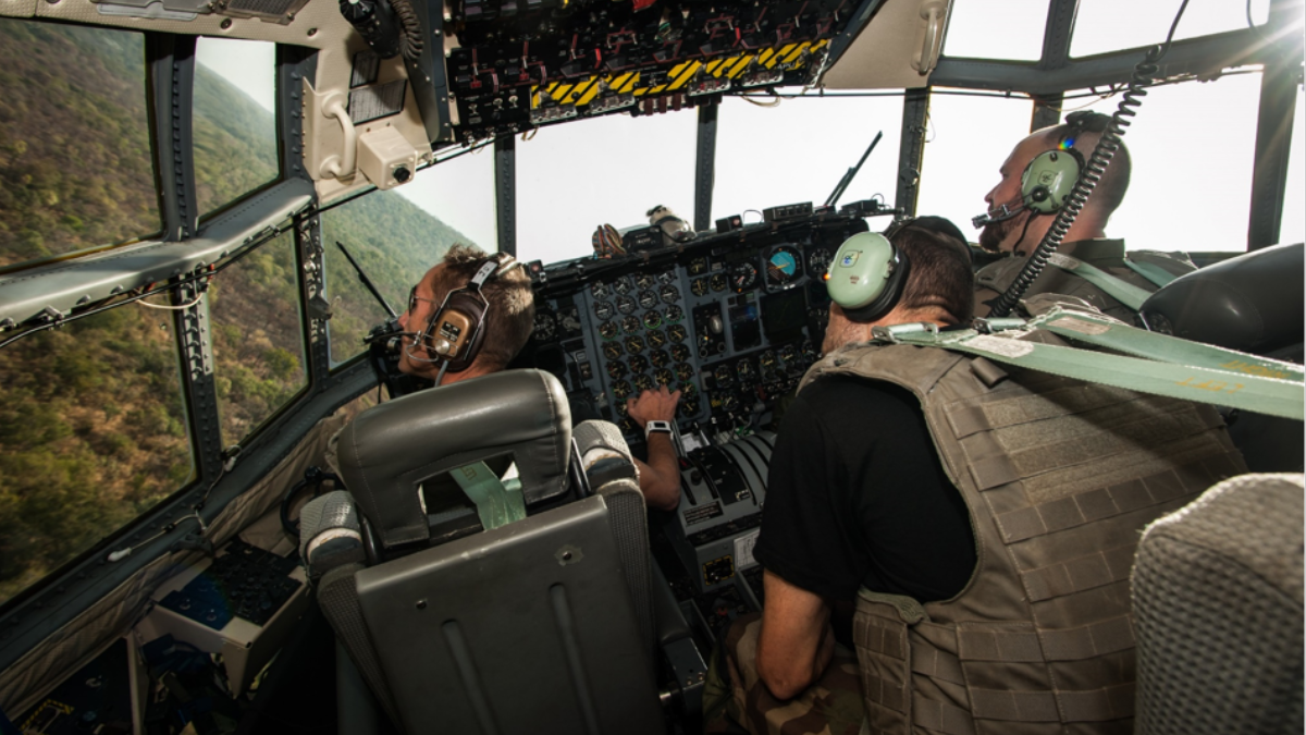 "A "Poitou" Squadron C-130 Hercules engaged in an assault landing touches down on the dirt runway at N'Délé", Central Africa, December 2013 © Bernard Sidler / ECPAD